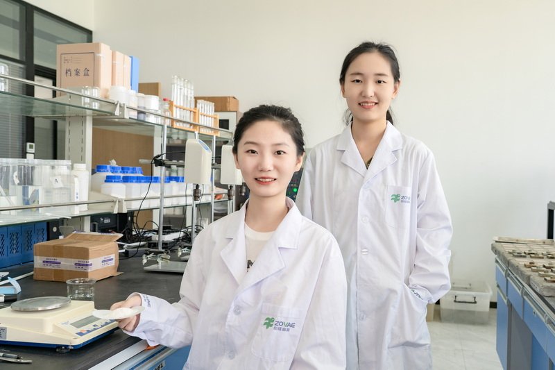 Engineers testing material strength in laboratory