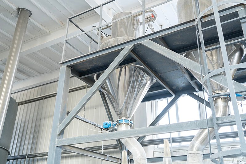 Team of engineers reviewing scalable workflow charts on digital screens