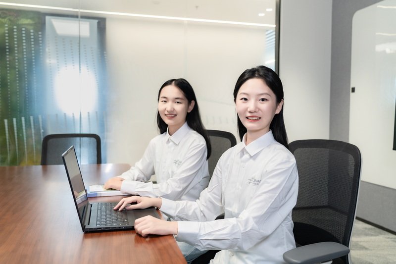 Customer support professionals in a modern office environment, representing expert guidance and personalized service