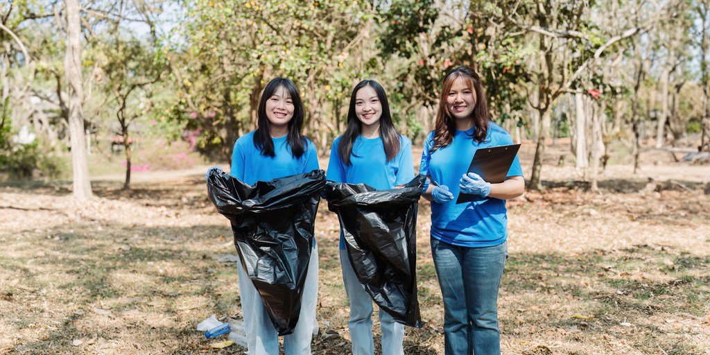 Young people cleaning public spaces