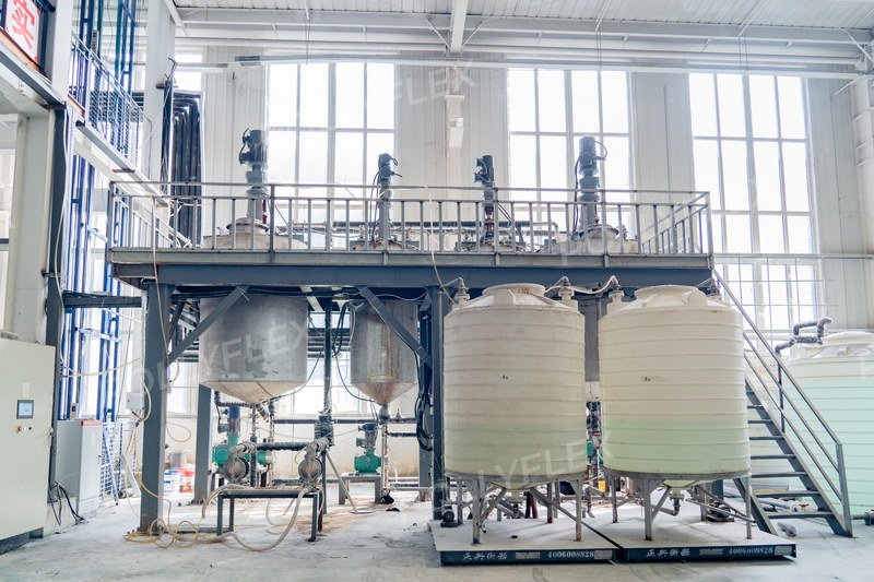Eight large emulsion storage tanks with capacity indicators