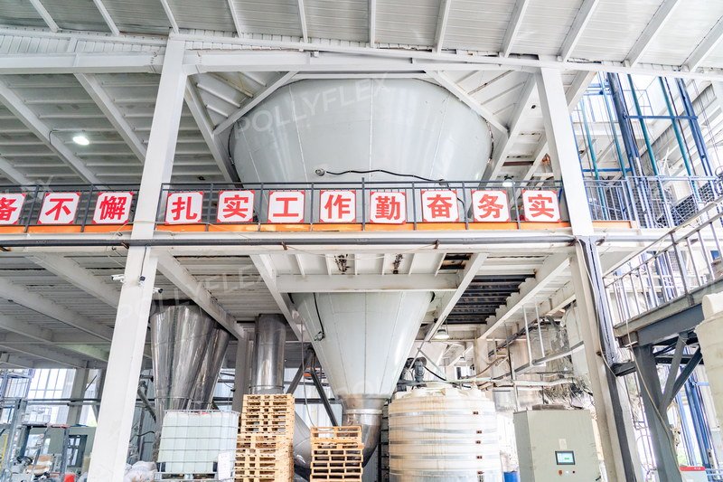 Production line showing high-capacity chemical mixing and scaling