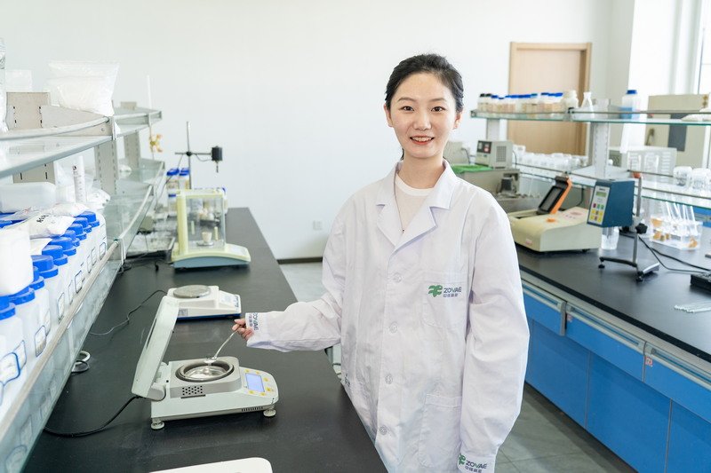 Scientists using analytical instruments for quality testing