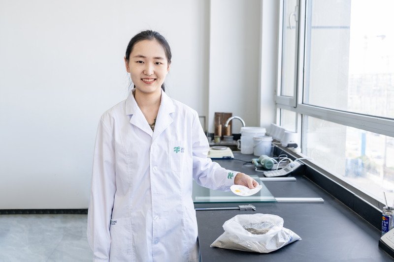 Engineers and material scientists in a modern laboratory, analyzing polymers